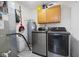 Well-organized laundry room with modern washer and dryer and cabinet storage at 7319 Jackie Ct, Indianapolis, IN 46221