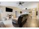 Cozy living room with a ceiling fan, entertainment center and open floor plan at 7319 Jackie Ct, Indianapolis, IN 46221