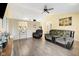 Spacious living room with vaulted ceiling, ceiling fan, and access to the dining area at 7319 Jackie Ct, Indianapolis, IN 46221