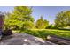 View of a well maintained backyard with lush lawn and mature trees at 734 Richland Way, Westfield, IN 46074