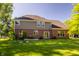 Large backyard with mature trees and landscaping offers a private outdoor retreat at 734 Richland Way, Westfield, IN 46074