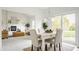 Light and airy dining room with backyard access and a modern chandelier at 734 Richland Way, Westfield, IN 46074