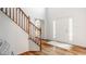Bright foyer with hardwood floors, stairs and a front door with sidelight windows at 734 Richland Way, Westfield, IN 46074