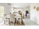 Bright eat-in kitchen featuring white cabinets, stainless appliances, and charming decor at 734 Richland Way, Westfield, IN 46074