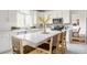 Modern kitchen with white cabinets, stainless steel appliances, and a center island with seating at 734 Richland Way, Westfield, IN 46074