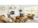 Bright living room with large windows, a fireplace, and cozy seating arrangement at 734 Richland Way, Westfield, IN 46074
