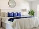 Bright main bedroom featuring a king-size bed and a decorative mirror at 734 Richland Way, Westfield, IN 46074