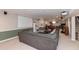 Spacious basement featuring a comfortable couch and a large screen, ideal for entertainment and relaxation at 8084 Lawrence Woods Pl, Indianapolis, IN 46236