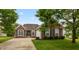 Charming single-story brick home with a well-manicured lawn and inviting curb appeal at 8084 Lawrence Woods Pl, Indianapolis, IN 46236