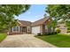 Charming single-story brick home with a well-manicured lawn and inviting curb appeal at 8084 Lawrence Woods Pl, Indianapolis, IN 46236