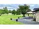 Spacious backyard with patio, gazebo, hot tub, and mature trees at 8102 Sycamore Springs Trl, Indianapolis, IN 46239