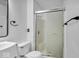 Clean and bright bathroom with a glass-enclosed shower and white fixtures at 8102 Sycamore Springs Trl, Indianapolis, IN 46239