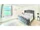 Cozy bedroom featuring a plush bed, window view, and stylish accents at 8102 Sycamore Springs Trl, Indianapolis, IN 46239