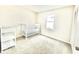 Bright bedroom with crib, shelving and large window at 8102 Sycamore Springs Trl, Indianapolis, IN 46239