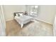 Comfortable bedroom with neutral tones, a window, and soft carpeting at 8102 Sycamore Springs Trl, Indianapolis, IN 46239