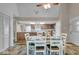 Open dining room with views to the kitchen, dining table and lots of light at 8102 Sycamore Springs Trl, Indianapolis, IN 46239