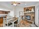 Dining room features a stone fireplace and seamlessly connects to the kitchen at 8102 Sycamore Springs Trl, Indianapolis, IN 46239