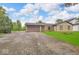 Charming stone facade home featuring a well-manicured lawn and attached two car garage at 8102 Sycamore Springs Trl, Indianapolis, IN 46239