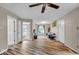 Open concept living room features lots of natural light and plank flooring at 8102 Sycamore Springs Trl, Indianapolis, IN 46239