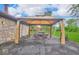 View of outdoor patio with gazebo, seating, and nearby hot tub at 8102 Sycamore Springs Trl, Indianapolis, IN 46239