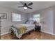 Neutral bedroom with hardwood floors, ceiling fan, and double window at 8246 S Franklin Rd, Indianapolis, IN 46259