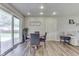 Dining room features a table with chairs and sliding glass doors to the yard at 8246 S Franklin Rd, Indianapolis, IN 46259