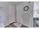 Bright entryway with wood-look flooring, white doors, and soft gray walls at 8246 S Franklin Rd, Indianapolis, IN 46259