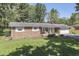 Inviting brick ranch-style home with a well-manicured lawn and attached one car garage at 8246 S Franklin Rd, Indianapolis, IN 46259