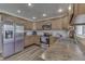 Well-lit kitchen with stainless steel appliances, wood cabinets, and stylish backsplash at 8246 S Franklin Rd, Indianapolis, IN 46259
