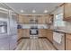 Well-equipped kitchen featuring stainless steel appliances and wood cabinetry at 8246 S Franklin Rd, Indianapolis, IN 46259