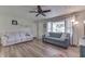 Spacious living room featuring wood-look floors, dual sofas and large windows for natural light at 8246 S Franklin Rd, Indianapolis, IN 46259