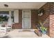 Cozy front porch with rocking chairs, potted plants, and a welcoming 'Home Sweet Home' doormat at 8246 S Franklin Rd, Indianapolis, IN 46259