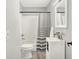 Cozy bathroom featuring a sink, a toilet, a shower and a shower curtain at 9002 Walton St, Indianapolis, IN 46231