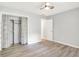 This light, bright bedroom features wood floors and a closet with a ruffled curtain at 9002 Walton St, Indianapolis, IN 46231