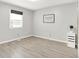 Bright bedroom featuring light walls and flooring, one window, and minimalist decor at 9002 Walton St, Indianapolis, IN 46231