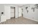 Neutral bedroom featuring light walls and flooring, modern decor, and open closet at 9002 Walton St, Indianapolis, IN 46231