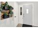 Bright entryway featuring neutral walls, a decorative plant, and a white front door at 9002 Walton St, Indianapolis, IN 46231