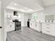 Modern kitchen with white cabinetry, stainless steel appliances, and plenty of counter space at 9002 Walton St, Indianapolis, IN 46231