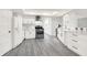 Open kitchen featuring white cabinets, stainless steel appliances, and ample counter space at 9002 Walton St, Indianapolis, IN 46231