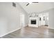 Well-lit living room with light gray walls, a fireplace, and entryway to the front door at 9002 Walton St, Indianapolis, IN 46231