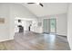 Inviting living room with gray walls, wood floors, leading to a kitchen and patio at 9002 Walton St, Indianapolis, IN 46231