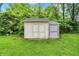 A view of the shed in the backyard with grass all around the shed at 9002 Walton St, Indianapolis, IN 46231