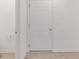 Bright basement with white door and wood-look flooring provides clean and modern space at 9136 Anthem Ave, Plainfield, IN 46168