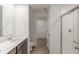 Modern bathroom featuring shower with glass door, sink, and views to the walk-in closet at 9136 Anthem Ave, Plainfield, IN 46168
