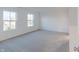 Spacious bedroom featuring neutral carpet, two windows, and ample natural light at 9136 Anthem Ave, Plainfield, IN 46168