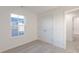 This cozy bedroom features neutral carpet, white walls, and a closet at 9136 Anthem Ave, Plainfield, IN 46168