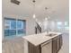 Open floorplan featuring a kitchen with island and stainless appliances, leading to the dining and living areas at 9136 Anthem Ave, Plainfield, IN 46168