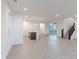 Bright open-concept space with hardwood floors, modern lighting, and lots of windows at 9136 Anthem Ave, Plainfield, IN 46168