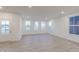 Bright living room with multiple windows, neutral walls, and hard surface floors at 9136 Anthem Ave, Plainfield, IN 46168