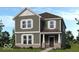 Charming two-story home featuring vertical siding, double hung windows, and a covered front porch at 9160 Anthem Ave, Plainfield, IN 46168